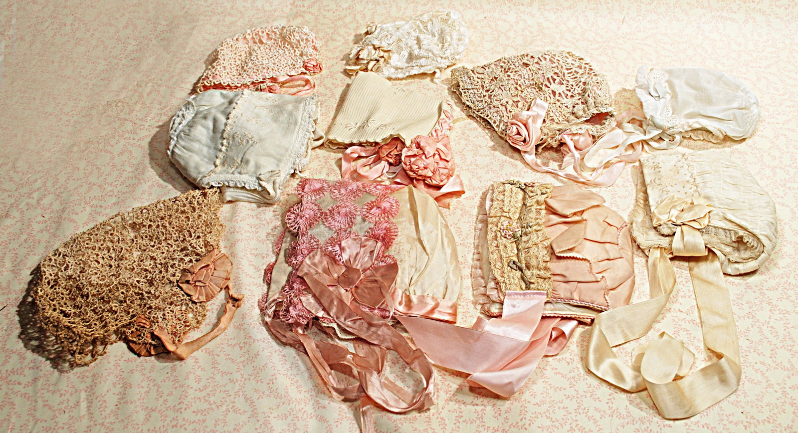 TEN ASSORTED DOLL BONNETS.: TEN ASSORTED DOLL BONNETS. Array of crocheted, silk, lace and cotton bonnets for large to medium size dolls, vintage and antique.