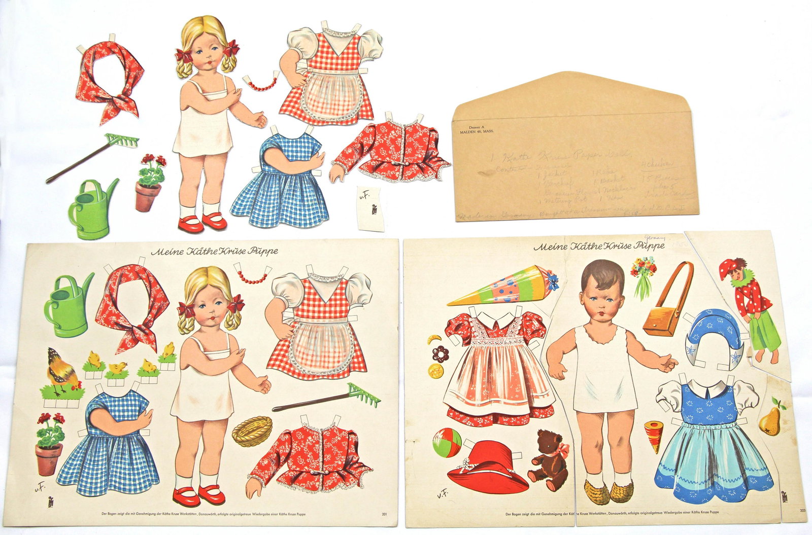 THREE SETS OF "MEINE KATHE KRUSE PUPPE" PAPER DOLLS,: THREE SETS OF "MEINE KATHE KRUSE PUPPE" PAPER DOLLS, MADE IN GERMANY. Two sets of the same doll and her costumes: one uncut 13 1/2" x 18" sheet and one cut (has missing chickens and hen but has envelo