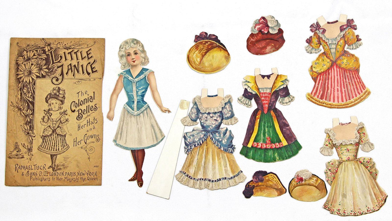 LITTLE JANICE PAPER DOLL BY RAPHAEL TUCK: LITTLE JANICE PAPER DOLL BY RAPHAEL TUCK. 9 1/2" Little Janie a Colonial Belle paper doll with her hats and gowns. Has original envelope with mark #751. Raphael Tuck and Sons Co. London, Paris, New Yo