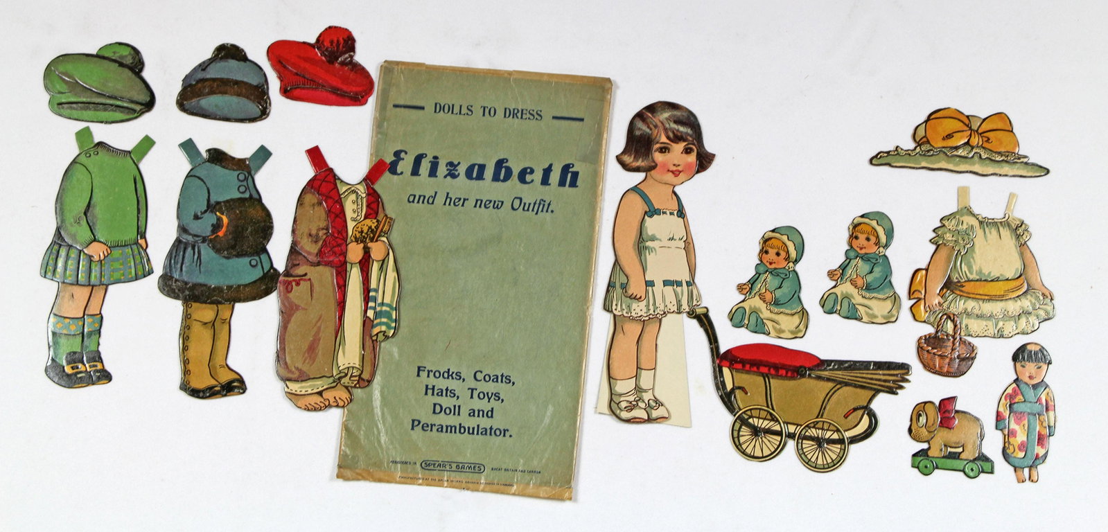 ENGLISH "DOLLS TO DRESS" PAPER DOLLS BY SPEARS: ENGLISH "DOLLS TO DRESS" PAPER DOLLS BY SPEARS. Two 7 1/2" dolls Elizabeth and Peggy made of heavy cardboard with embossed varnished detail. Each with embossed various frocks, toys, and original envel