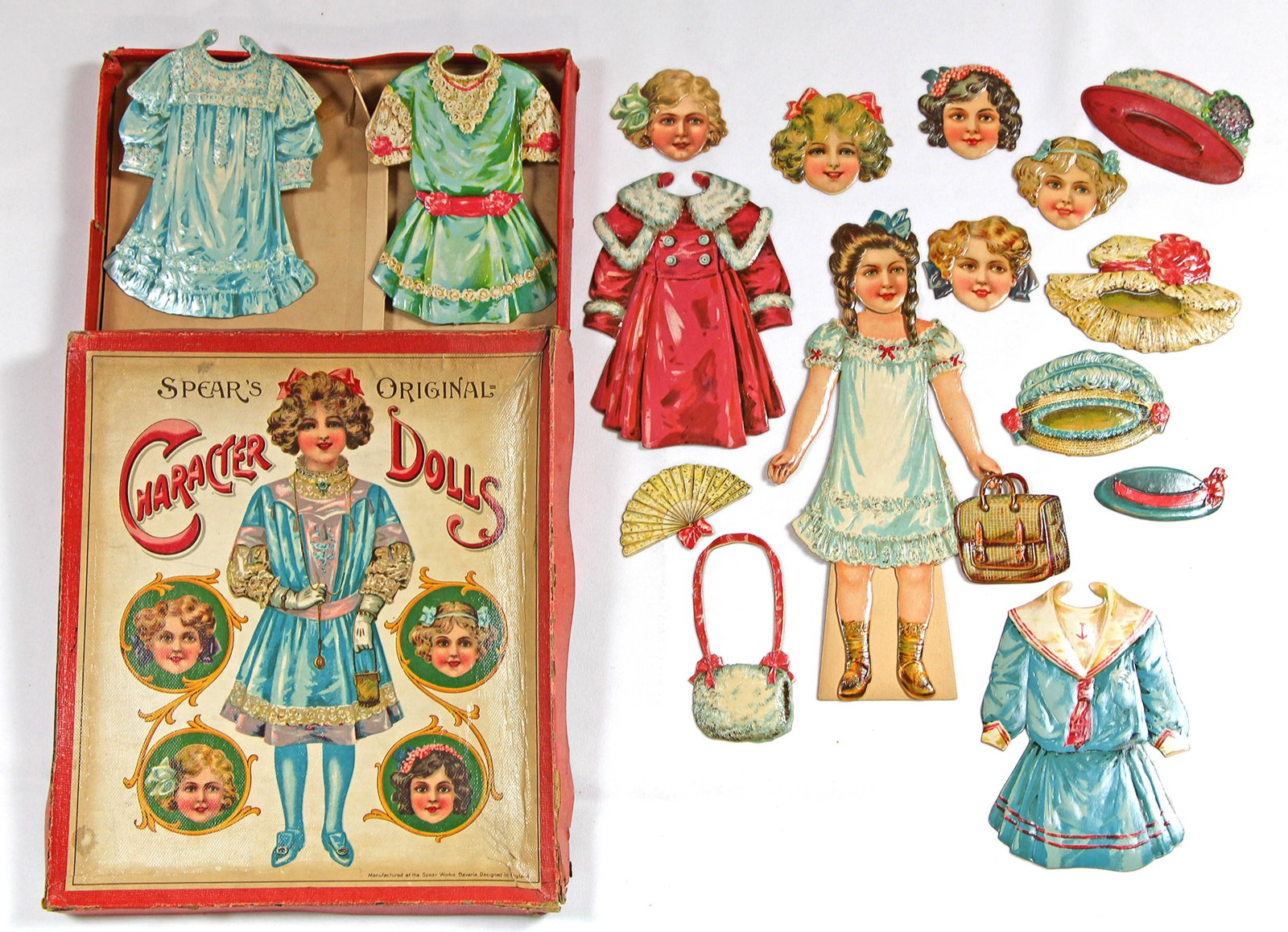 TWO SETS OF "CHARACTER DOLLS" WITH INTERCHANGEABLE: TWO SETS OF "CHARACTER DOLLS" WITH INTERCHANGEABLE HEADS BY SPEAR. One set in original box with colorful cover, has 10" doll with 6 interchangeable heads, 4 single sided embossed frocks, hats, and acc