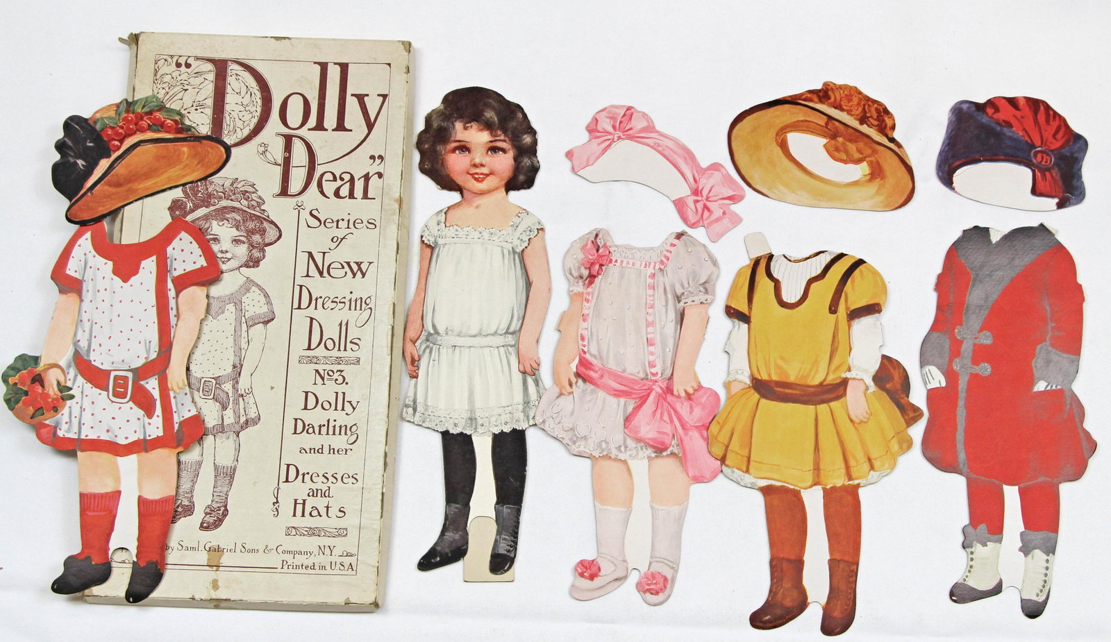 THREE "DAINTY DOLLY" AND ONE "DOLLY DEAR" DRESSING: THREE "DAINTY DOLLY" AND ONE "DOLLY DEAR" DRESSING DOLLS BY GABRIEL. 14" cardboard dressing dolls. No D131 "Willie and his wardrobe" has 3 costumes, one hat, and top of original box. No D121 "Gladys a