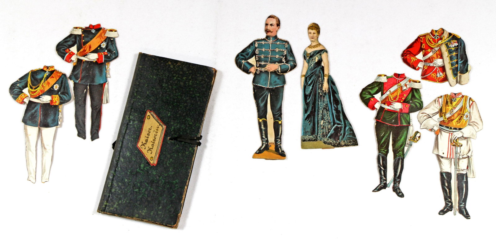 GERMAN ROYALTY PAPER DOLLS, 1880s: GERMAN ROYALTY PAPER DOLLS, 1880s. Charming pocket size folder box titled "Kaiser. Kaiserin.", containing 5 1/2" paper doll of Kaiserine Victoria Augusta and 6 1/4" paper doll of Kaiser Wilhelm II wit