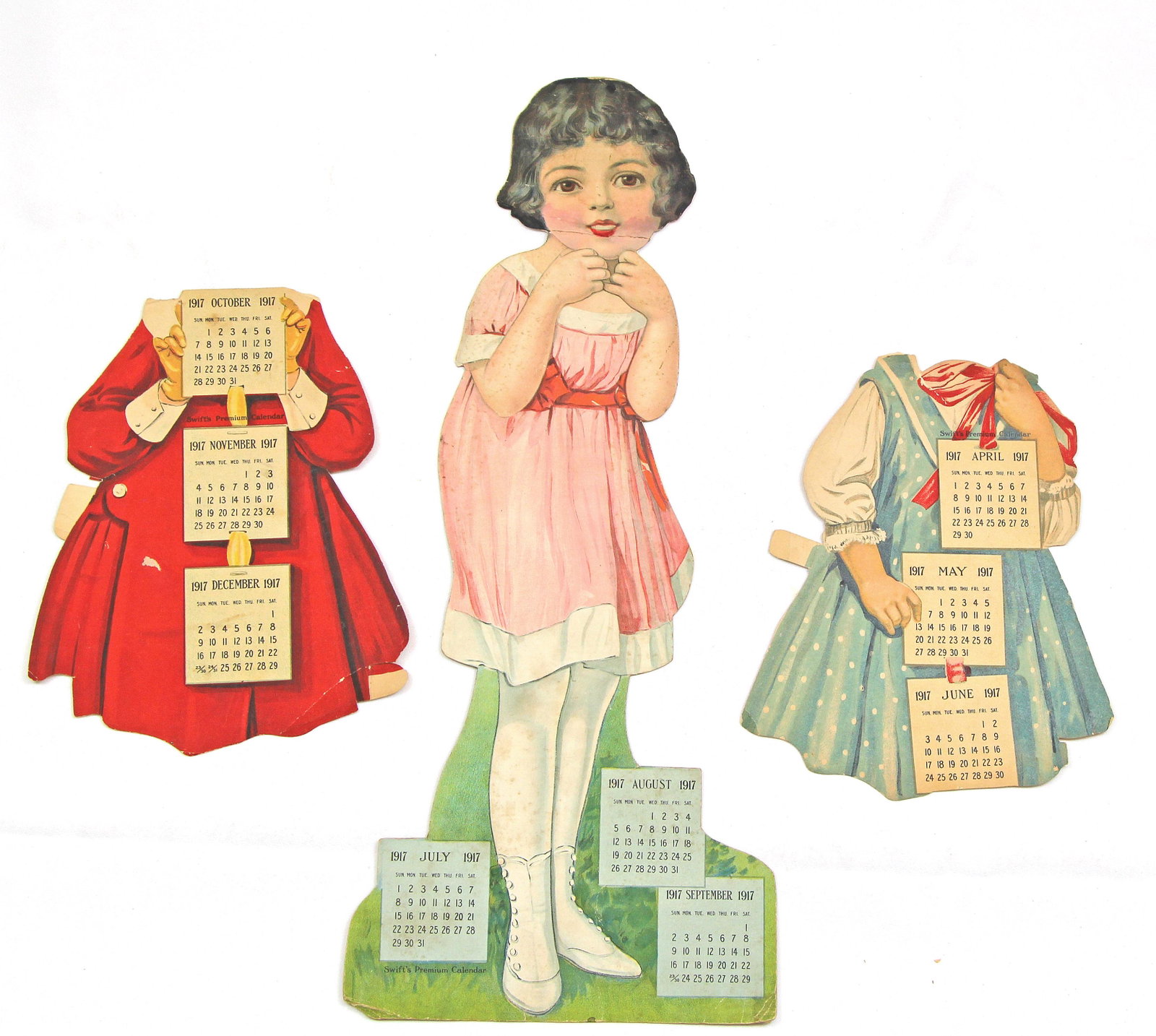 FOUR PAPER DOLLS, late 1800s – early 1900s: FOUR PAPER DOLLS, late 1800s – early 1900s. 19" cardstock paper doll Clarabel with two outfits by Swift’s Premium Advertisement calendar paper doll, 1917; 19" cardstock Sally Lou paper doll with 5