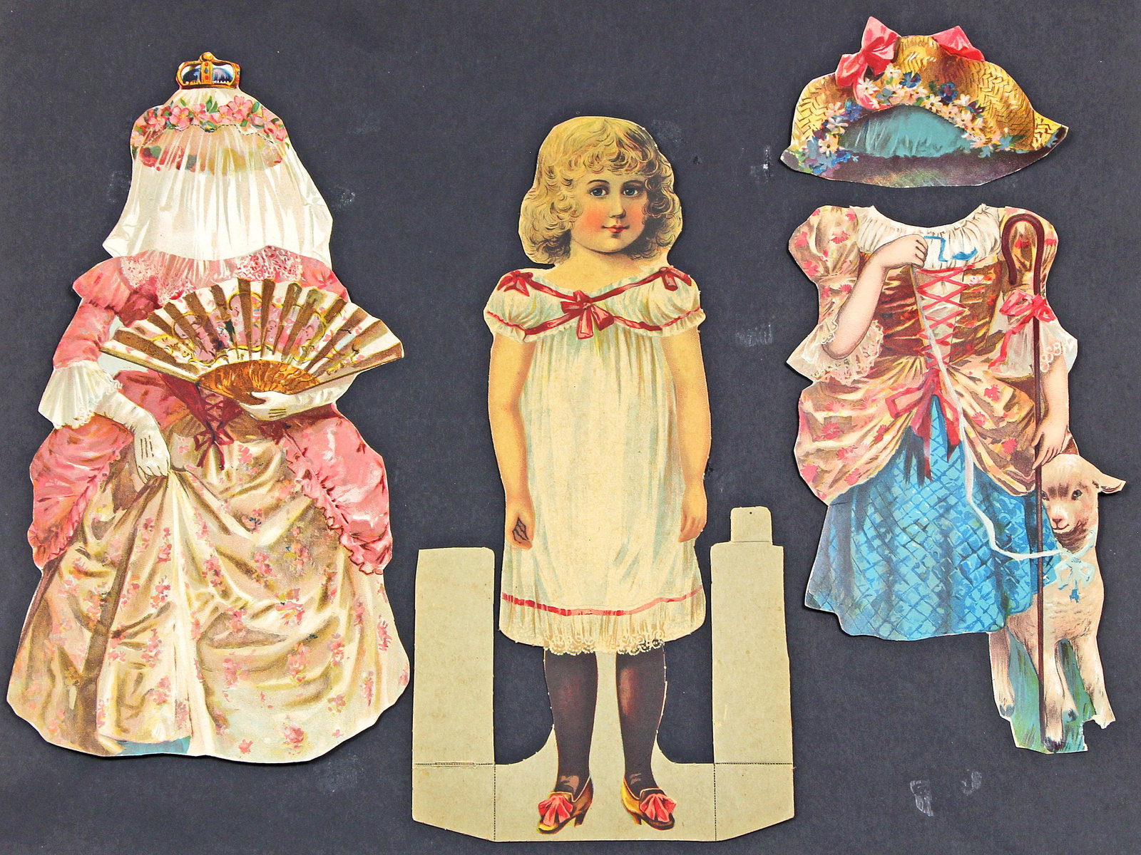 TWO "FAIR FRANCES" DRESSING DOLLS BY R. TUCK, 1894: TWO "FAIR FRANCES" DRESSING DOLLS BY R. TUCK, 1894 . Two 10 1/2" Fair Frances cardstock paper dolls, each with two dresses and hats. Part of Dainty Dollies Series of dressing dolls by Raphael Tuck. Ci