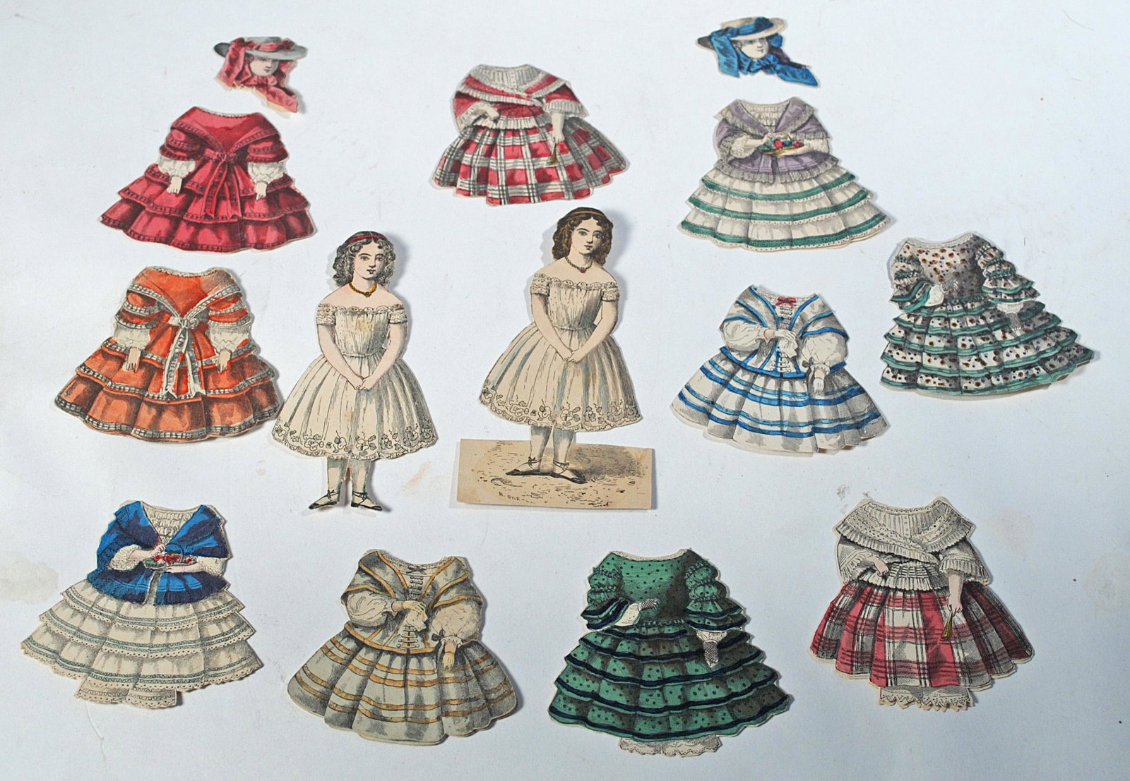 MCLOUGHLIN 1859 PAPER DOLL "LILLY BEERS".: MCLOUGHLIN 1859 PAPER DOLL "LILLY BEERS". Very rare, original 1859 "Lilly Beers”, from the McLoughlin Series titled simply "Paper Dolls" on the advertising flyer published in 1859. Includes two 4”