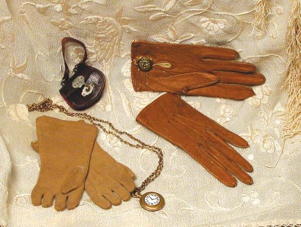 TWO PAIR OF DOLL GLOVES. (1) 4" L. Soft, light b: TWO PAIR OF DOLL GLOVES. (1) 4" L. Soft, light brown kid leather gloves have cast-bound edging, snap closing with fancy buttons; (2) 3 ½" L. pair of tan suede cloth gloves inset thumbs and stitching 