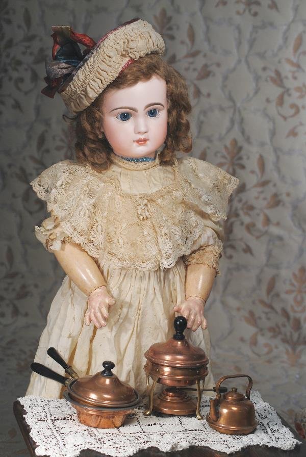 FRENCH BISQUE BEBE BY JUMEAU. Marks: Depose Tet: FRENCH BISQUE BEBE BY JUMEAU. Marks: Depose Tete Jumeau 12. 28". Bisque socket head, blue paperweight eyes, painted lashes, eyeliner, feathered and brushstroked brows, pierced ears, closed mouth, shad