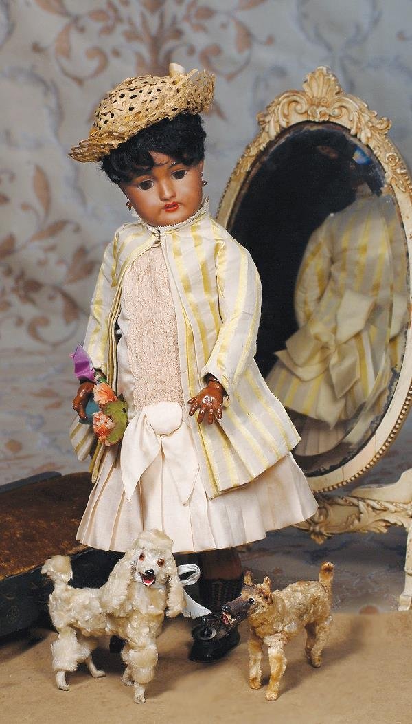 TWO MINIATURE ANTIQUE FRENCH DOGS. (1) 4 ½" H.: TWO MINIATURE ANTIQUE FRENCH DOGS. (1) 4 ½" H. White curly-plush, poseable poodle with molded papier mache head, brown glass eyes, open mouth with painted nose, mouth and tongue. (2) 3 ½" H. Light g