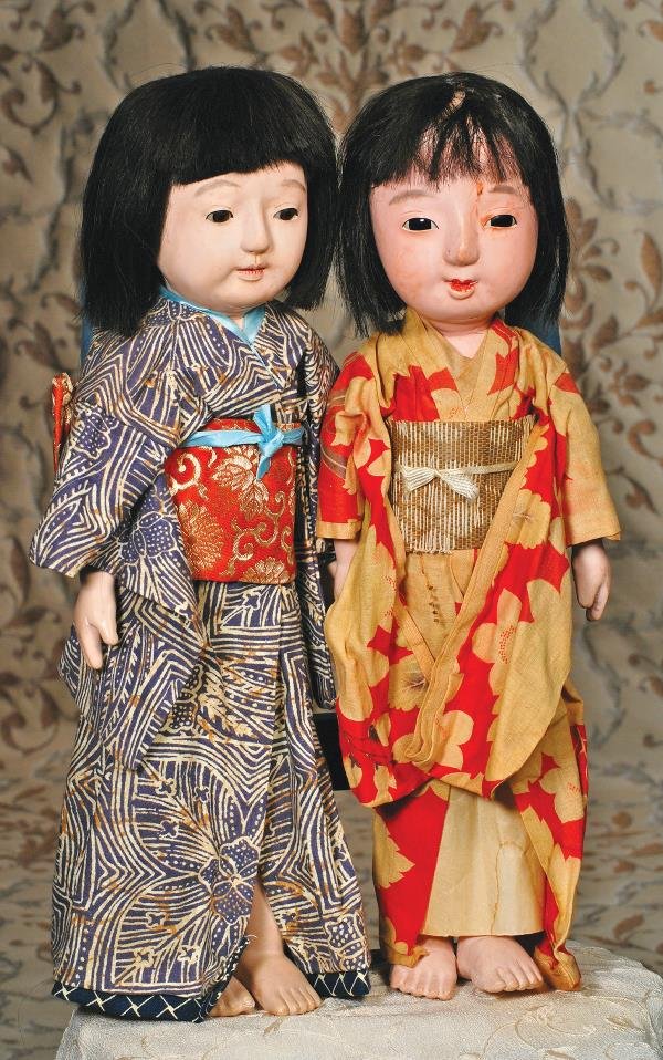 TWO JAPANESE ICHIMATSU DOLLS. 17". Each has pa: TWO JAPANESE ICHIMATSU DOLLS. 17". Each has papier mache head with inset enamel eyes, breather nostrils, closed mouth, black wig, papier mache shoulderplate and lower torso, cloth midriff, upper arms 