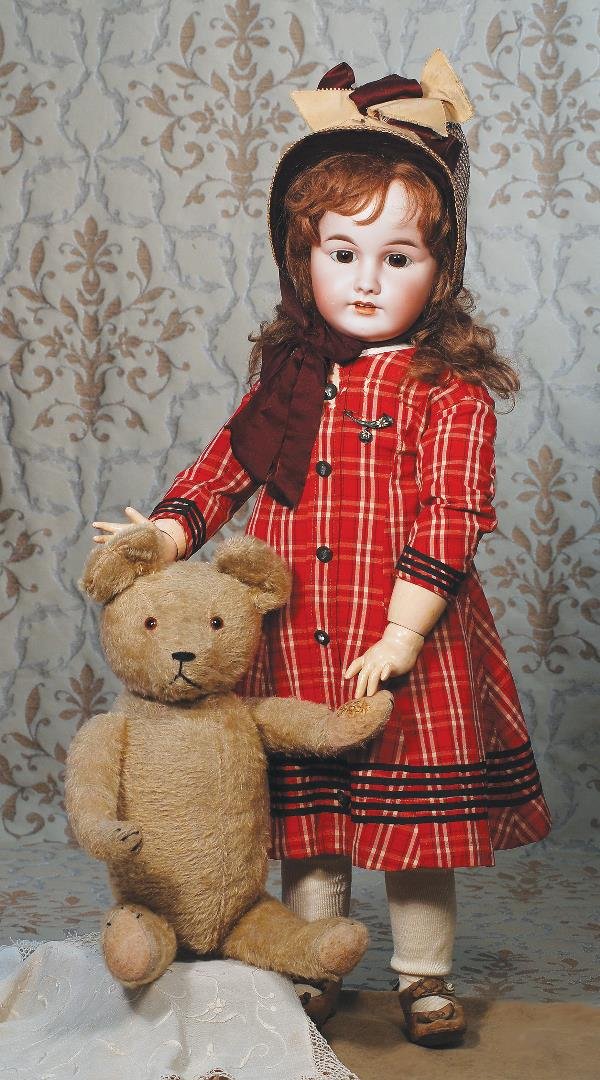 TAN MOHAIR TEDDY BEAR. 19". Straw-filled tan m: TAN MOHAIR TEDDY BEAR. 19". Straw-filled tan mohair bear has amber glass eyes, floss nose, mouth and claws, felt pads; fully-jointed with wide head, large ears, and football-shaped torso. Commentary: 