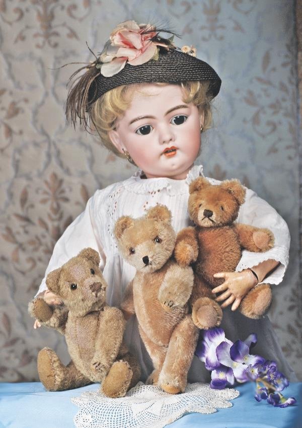 THREE GERMAN MOHAIR TEDDY BEARS. Each is straw-: THREE GERMAN MOHAIR TEDDY BEARS. Each is straw-filled, fully-jointed and has floss nose, mouth and claws, amber glass eyes. Includes 8 ½" early bear with replaced felt pads and worn spots to mohair; 