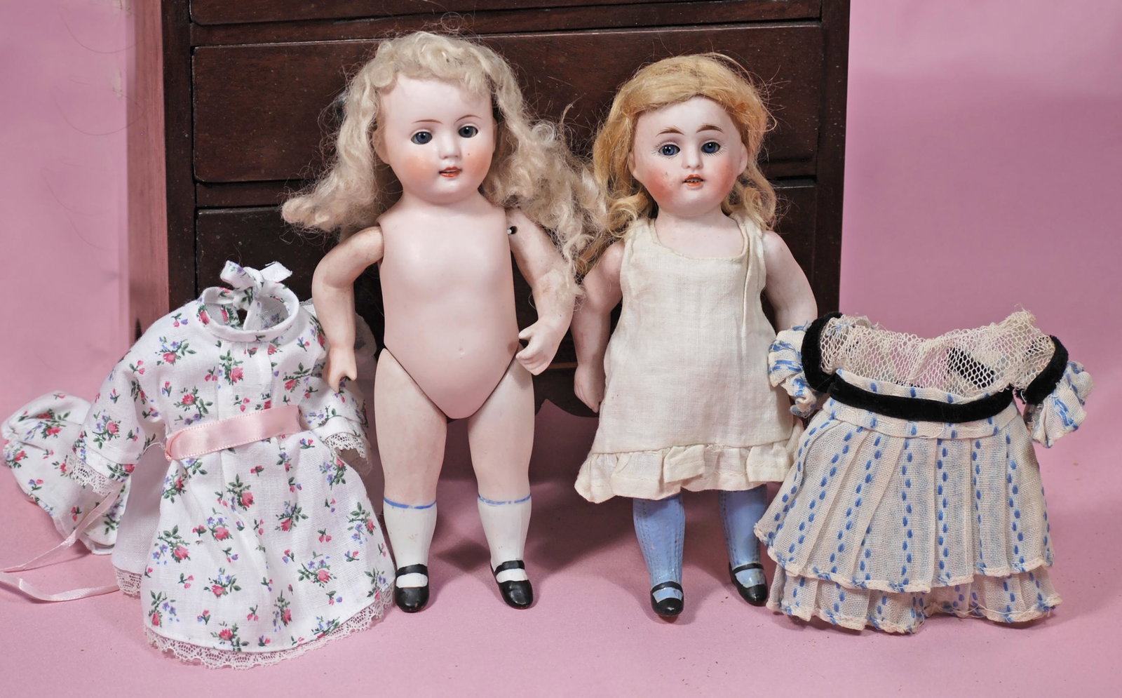 TWO GERMAN ALL-BISQUE DOLLS: TWO GERMAN ALL-BISQUE DOLLS. 7". Each is all-bisque with sleep eyes, painted lashes, open mouth, upper teeth, painted knee socks and shoes, jointed shoulders and hips. Kestner marked 150, original blo
