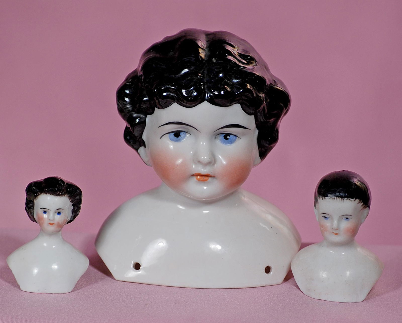 THREE CHINA SHOULDER HEADS. (1 of 1)