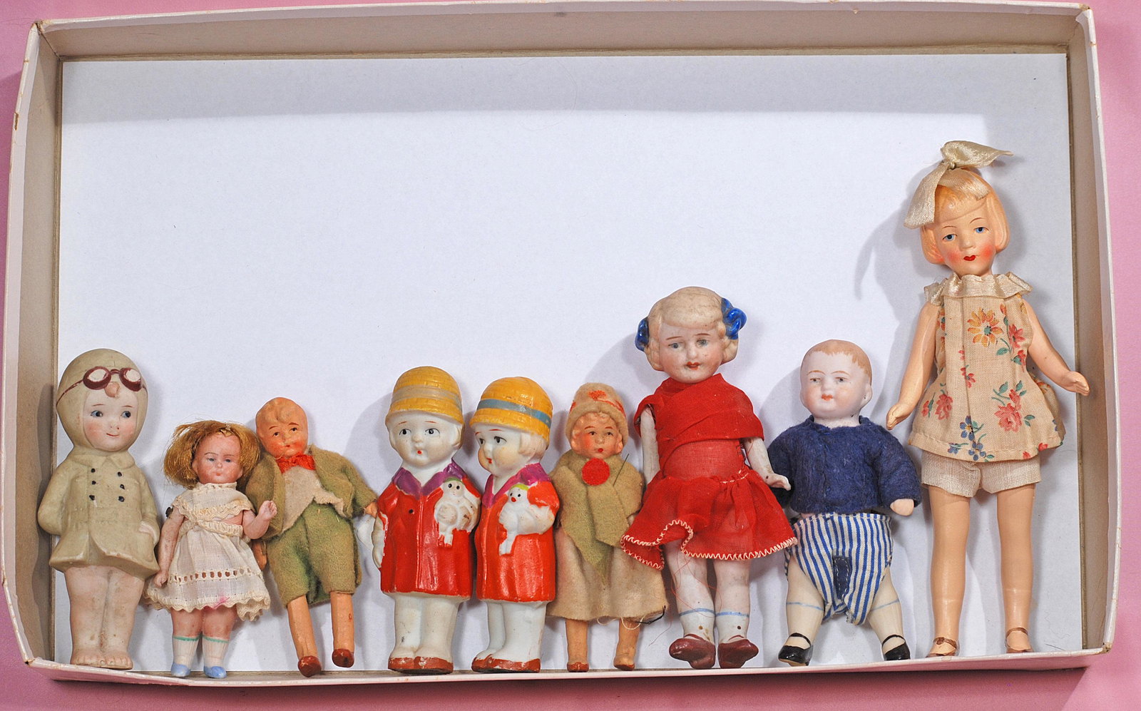 GROUP OF NINE ALL-BISQUE DOLLS (1 of 1)
