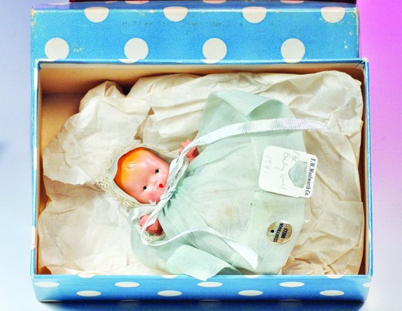 NANCY ANN STORYBOOK "HUSH-A-BYE BABY" # 201. Pain: NANCY ANN STORYBOOK "HUSH-A-BYE BABY" # 201. Painted all-bisque 3 ½" bent limb baby doll has painted hair and features, blue organdy dress and bonnet, gold sticker, F. W. Woolworth store tag, in blue