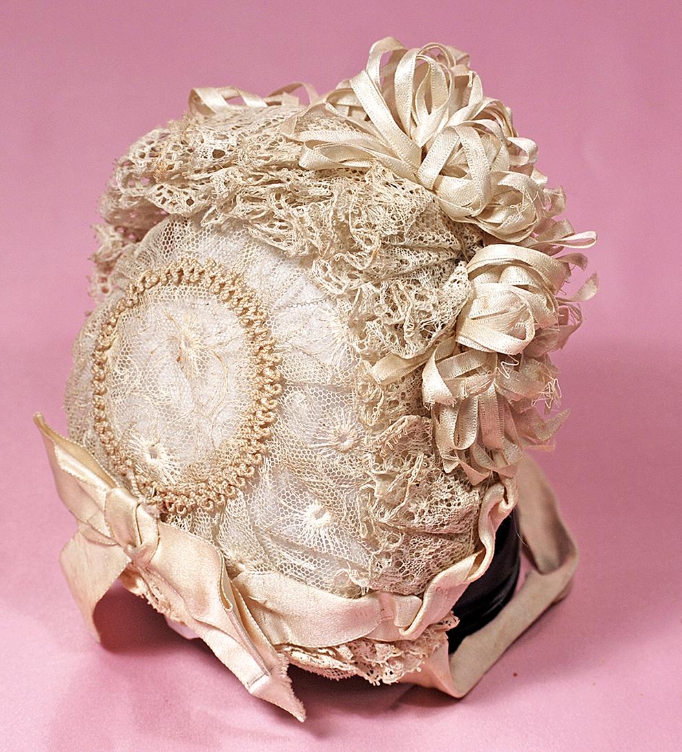 ANTIQUE LACE BONNET WITH SILK RIBBONS. (1 of 1)