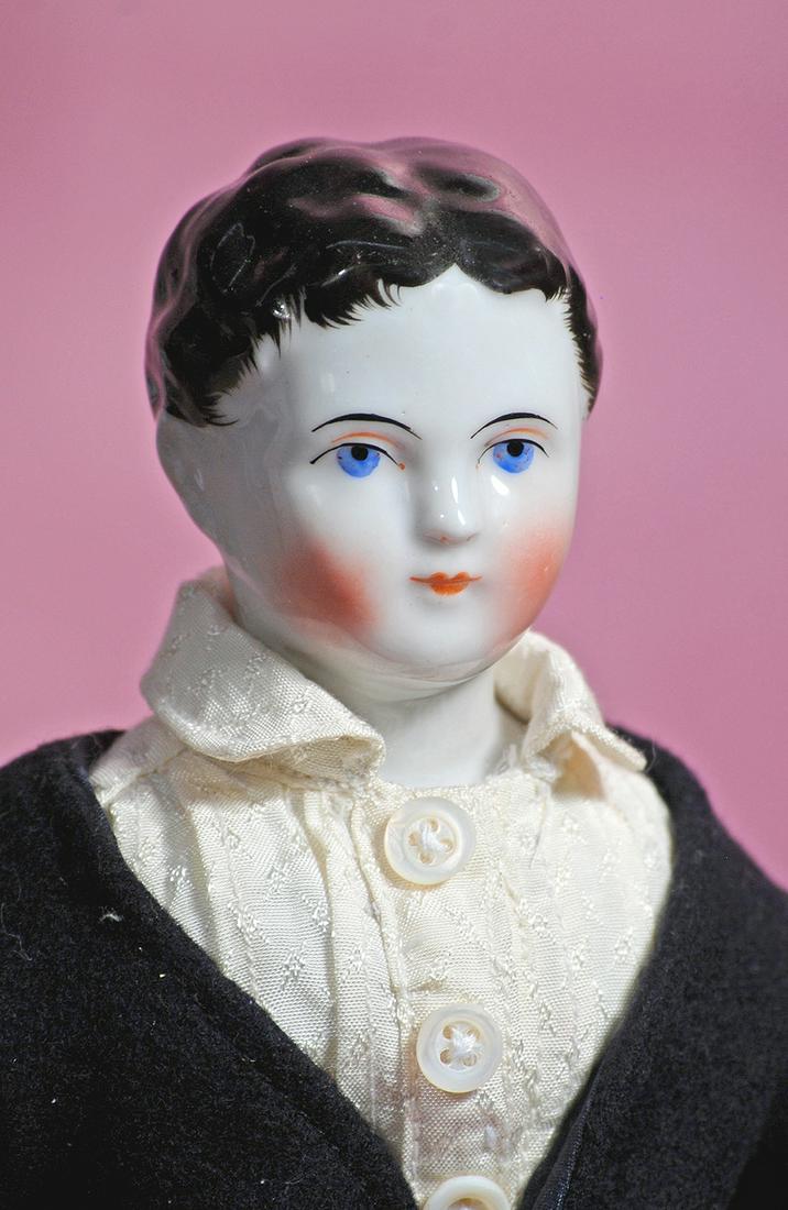GERMAN PORCELAIN DOLL DEPICTING YOUNG LAD. (1 of 2)