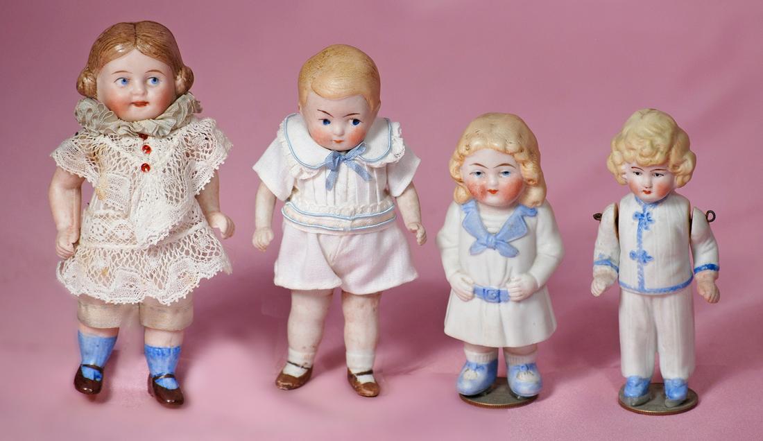 FOUR MINIATURE GERMAN ALL-BISQUE DOLLS. (1 of 1)