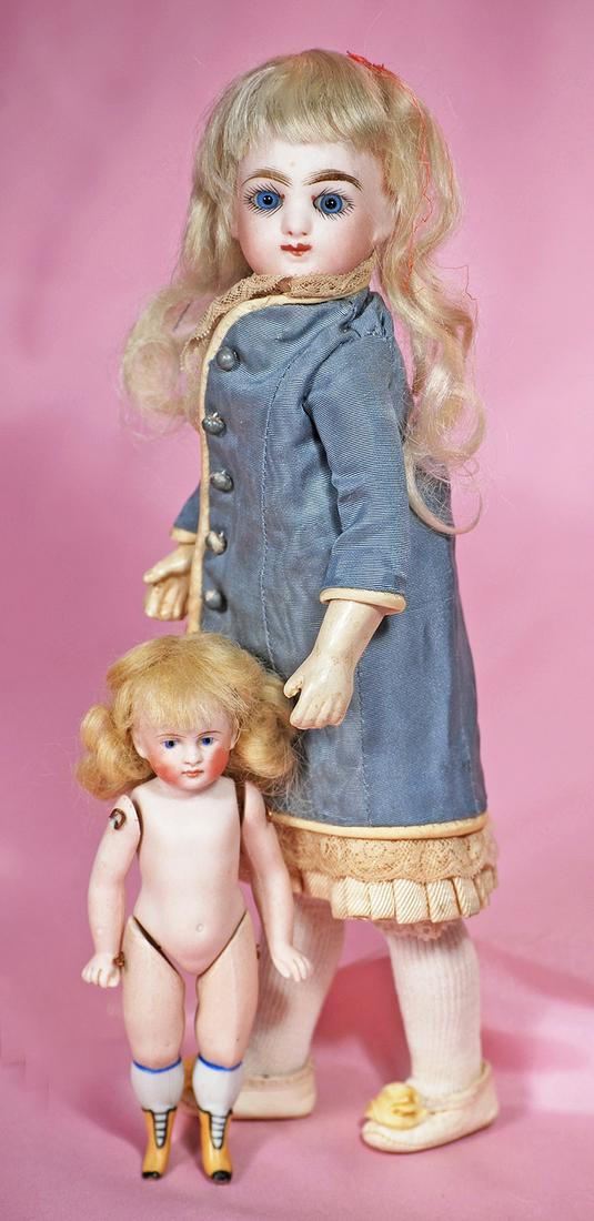 GERMAN ALL-BISQUE DOLL WITH YELLOW BOOTS. (1 of 2)