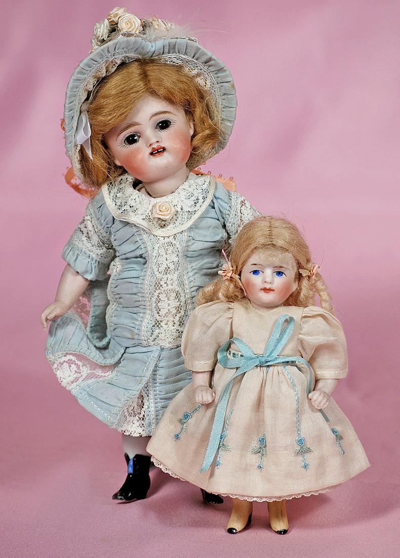 GERMAN ALL-BISQUE DOLL WITH YELLOW BOOTS. (1 of 2)