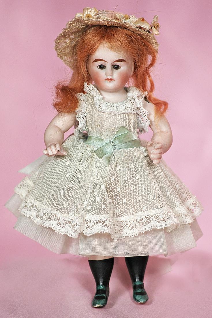 GERMAN ALL-BISQUE DOLL WITH TEAL GREEN BOOTS. (1 of 1)