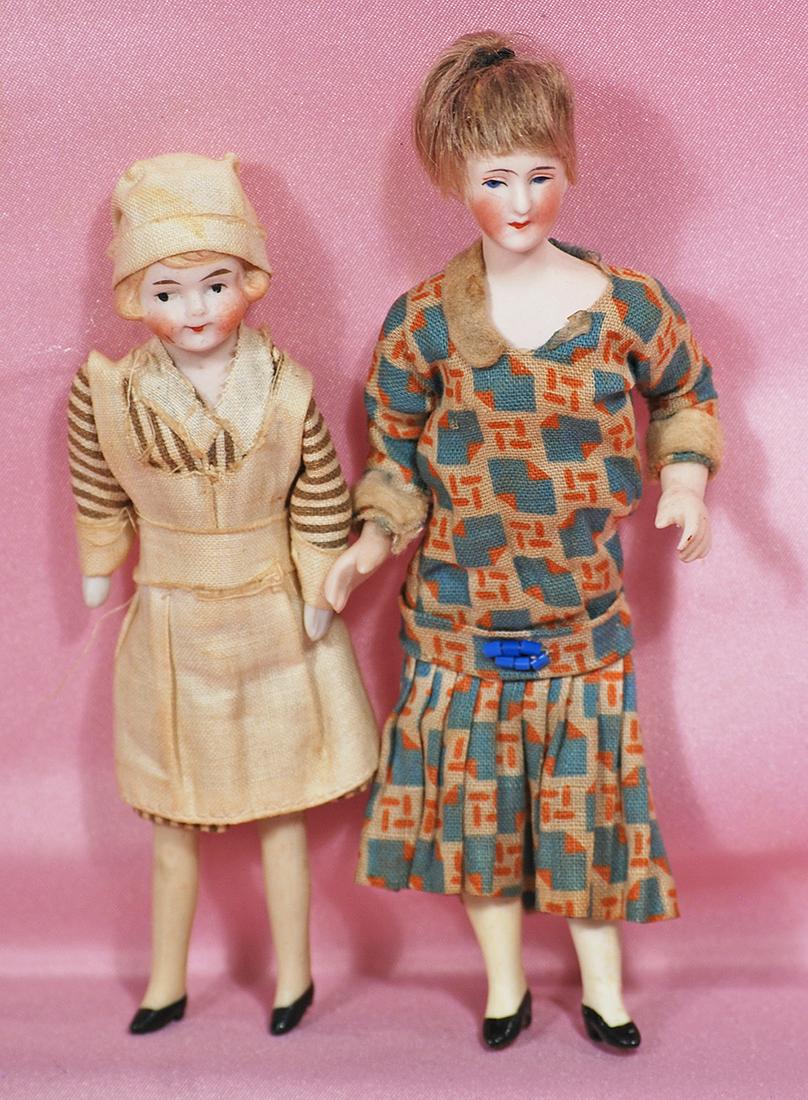 TWO GERMAN BISQUE DOLL HOUSE DOLLS. (1 of 1)
