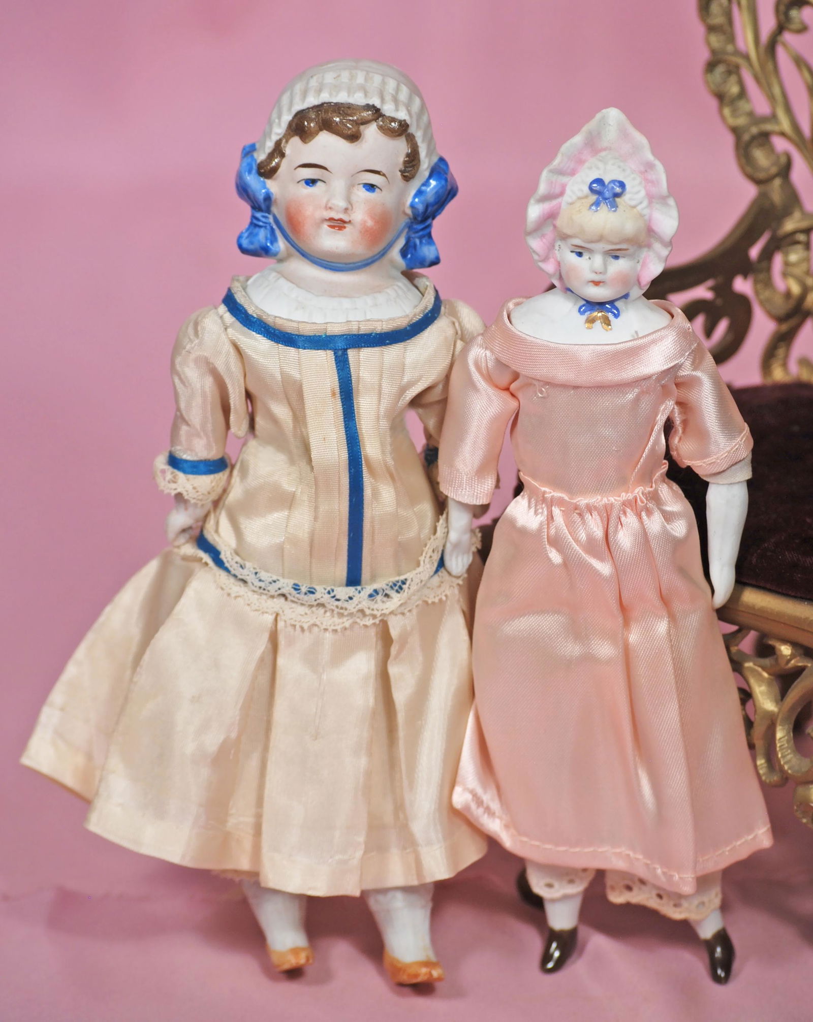 TWO GERMAN BISQUE DOLLS WITH SCULPTED BONNET. 8”. Each (1 of 1)