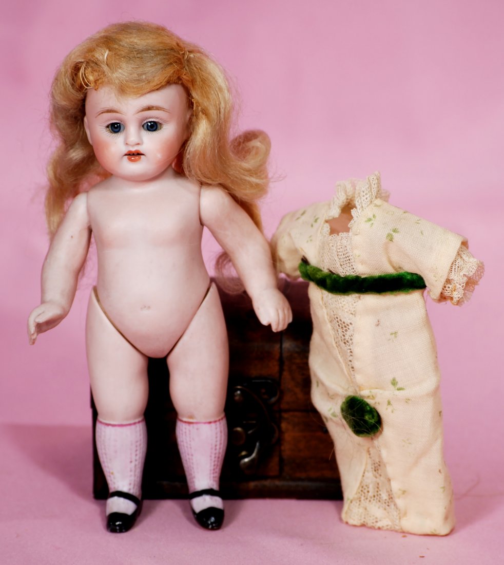 KESTNER ALL-BISQUE DOLL WITH PINK STOCKINGS.: 277. KESTNER ALL-BISQUE DOLL WITH PINK STOCKINGS. 6 1/2". Marks: 150. All-bisque, jointed at shoulders and hips, brown sleep eyes, painted lashes, feathered brows, open mouth, shaded lips, upper teeth