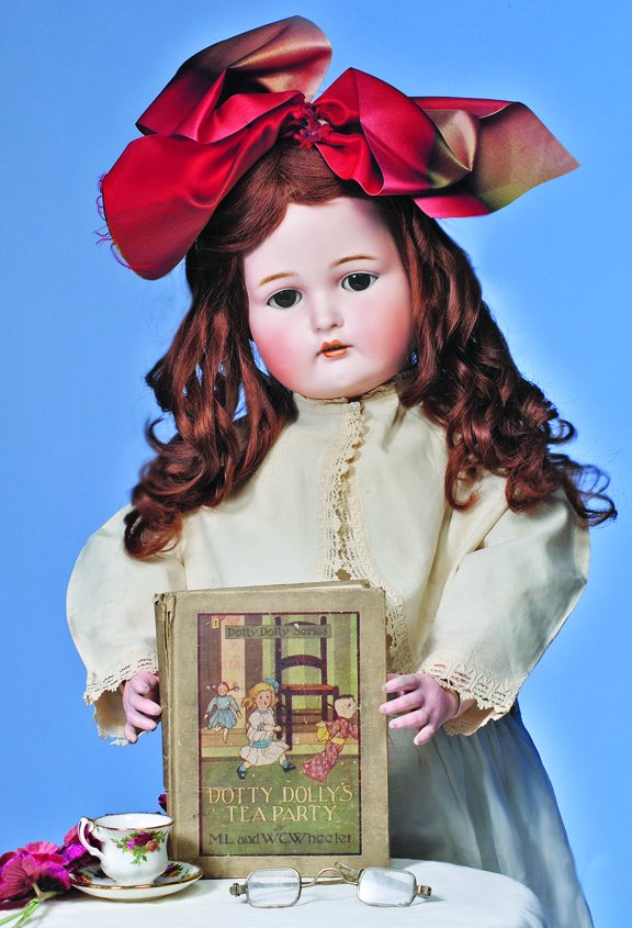 LARGE KAMMER & REINHARDT DOLL WITH HER STORYBOOK & R: LARGE KAMMER & REINHARDT DOLL WITH HER STORYBOOK & READING GLASSES. Marks: S & H, K * R. 30". Bisque socket head, brown sleep eyes, painted lashes, eyeliner, molded and feathered brows, open mouth, ac