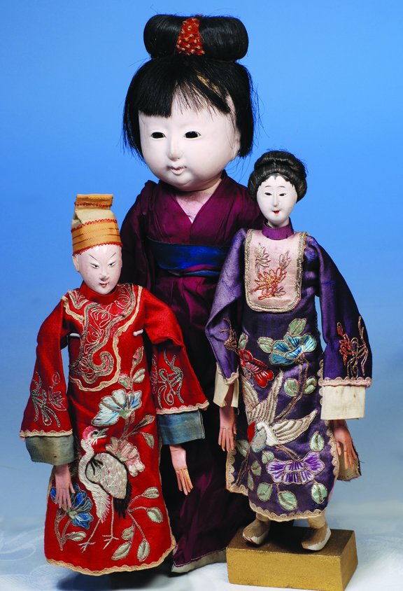 TWO JAPANESE THEATRE DOLLS. 10 ½". Gofun finished: TWO JAPANESE THEATRE DOLLS. 10 ½". Gofun finished heads; woman has dark enamel eyes, man has painted eyes; each has wooden torso with metal limbs and carved wooden lower legs and feet, lower arms wit