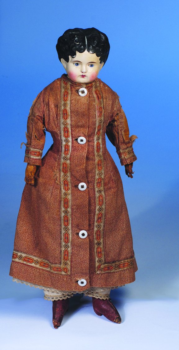 GERMAN PAPIER MACHE DOLL. Unmarked. 15 ½". Papie: GERMAN PAPIER MACHE DOLL. Unmarked. 15 ½". Papier mache shoulderhead, molded and painted black hair in curls and waves with center-part, painted features, blue eyes, tapered brows, closed mouth, blus