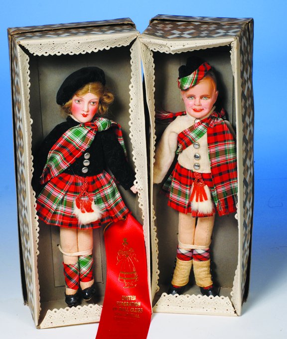PAIR OF PAPIER MACHE SCOTTISH HIGHLANDER DOLLS IN : PAIR OF PAPIER MACHE SCOTTISH HIGHLANDER DOLLS IN ORIGINAL BOX. 10". Each has molded papier mache head on stockinette body with slender limbs and stitched joints, (girl has papier mache arms); Boy has
