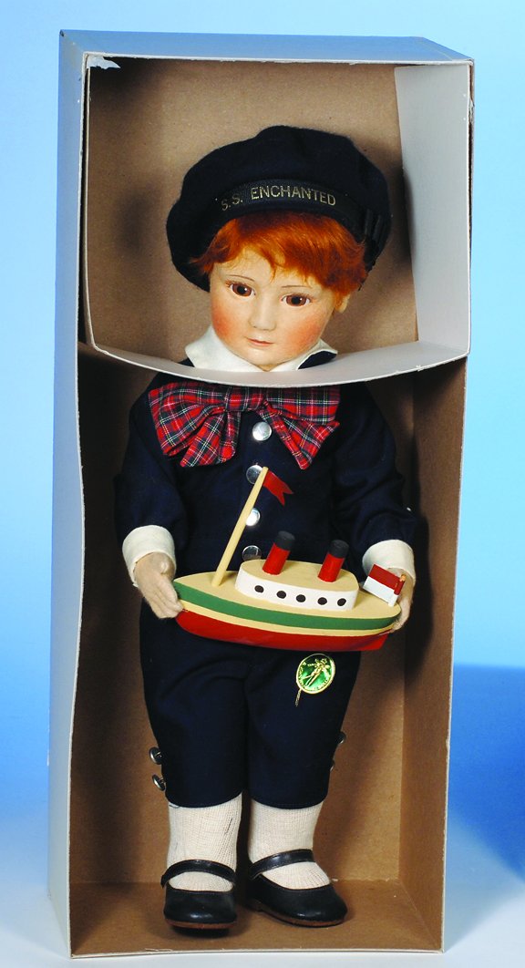 R. JOHN WRIGHT "CAPTAIN COREY". 18". All-felt, f: R. JOHN WRIGHT "CAPTAIN COREY". 18". All-felt, fully-jointed, mohair wig, painted features, navy blue cotton costume, leather shoes, holds wooden toy ship. Commentary: Circa 1980's; Made exclusively f