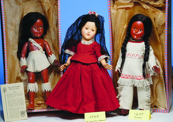 EFFANBEE 1492 PRIMITIVE INDIAN. Brown skin, dark: EFFANBEE 1492 PRIMITIVE INDIAN. Brown skin, dark long wig, brown eyes, white buckskin costume, wrist bracelet, booklet and box. Commentary: Excellent condition.