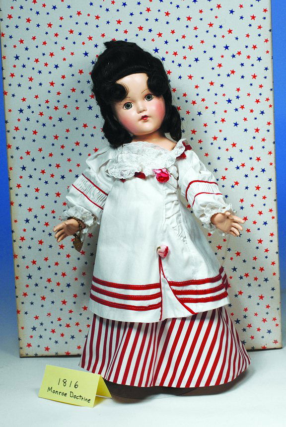 EFFANBEE 1816 MONROE DOCTRINE. Green eyes, brune: EFFANBEE 1816 MONROE DOCTRINE. Green eyes, brunette wig with waves, braided coronet and shoulder-length curls, white and red cotton dress with shirred detail, lace and rose accents, petticoat, panta-l