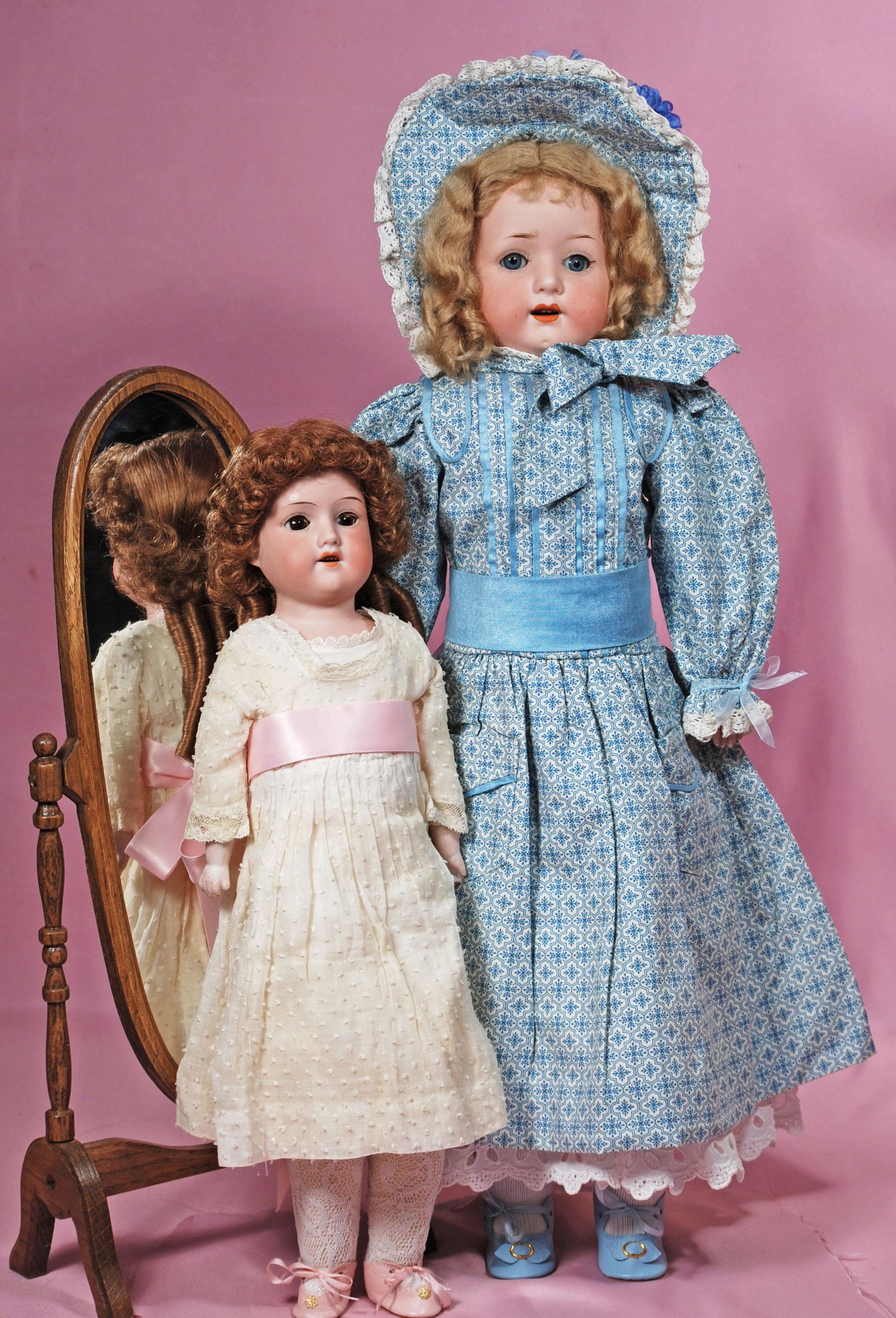 TWO GERMAN BISQUE DOLLS: TWO GERMAN BISQUE DOLLS. Each is bisque shoulderhead with sleep eyes, painted and applied lashes, open mouth, upper teeth, kid body with bisque forearms. 20" doll marked Heubach Kopplesdor f 275 has m