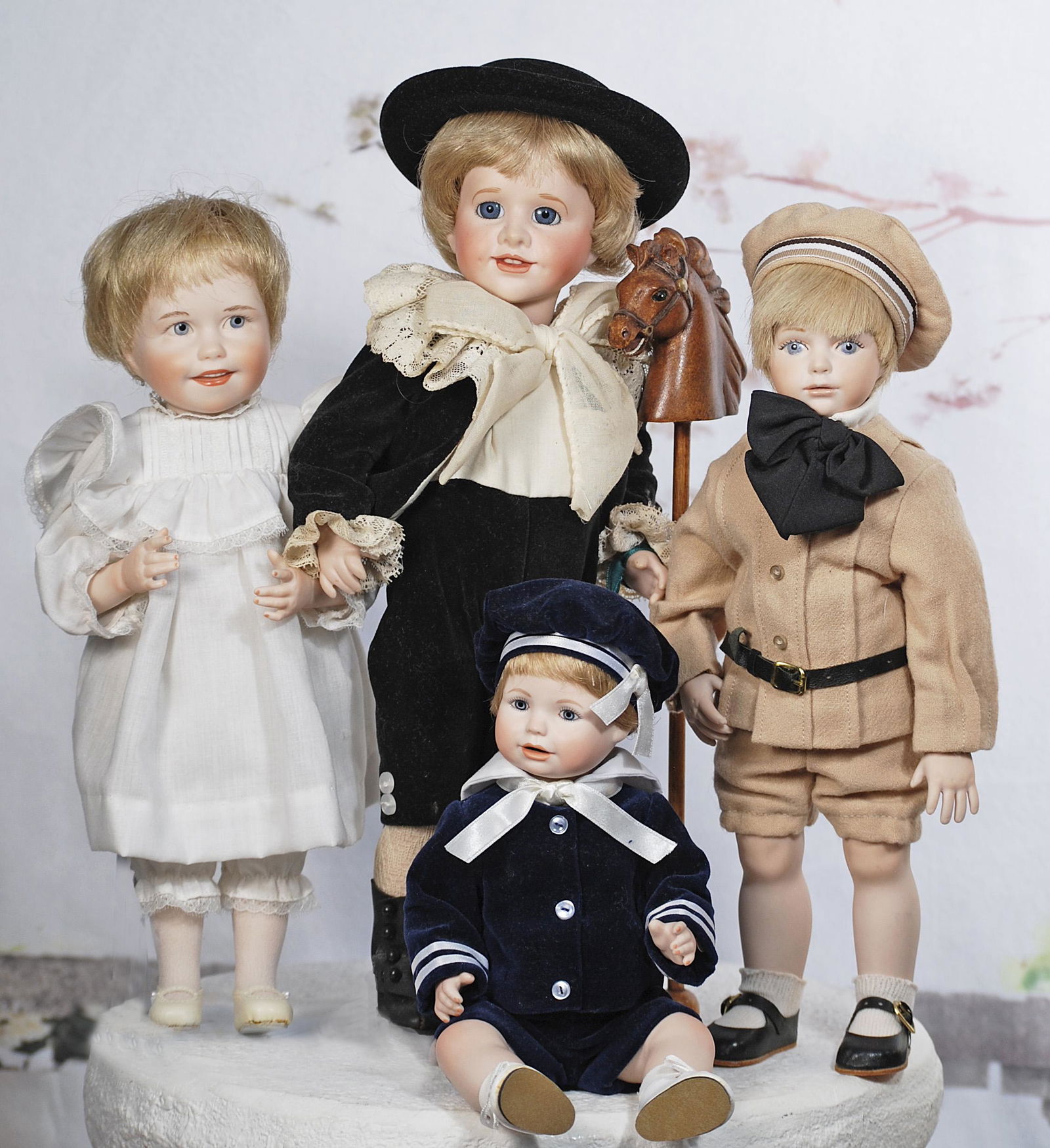 FOUR CONTEMPORARY BISQUE DOLLS. (1 of 1)