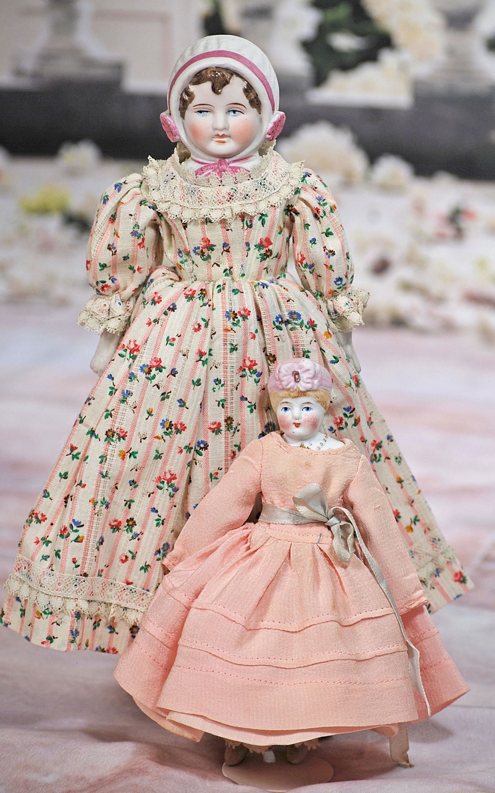 TWO BISQUE DOLLS WITH SCULPTED BISQUE BONNET (1 of 1)