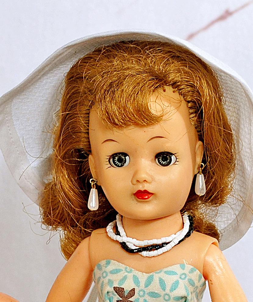 IDEAL LITTLE MISS REVLON AQUA SUNSUIT OUTFIT: IDEAL LITTLE MISS REVLON AQUA SUNSUIT OUTFIT. 10 ½”. Marks: Ideal Doll 10 ½ VT. Vinyl socket head, lady body, swivel waist, sleep eyes, molded lashes, rooted brown hair, wears costume aqua and whi