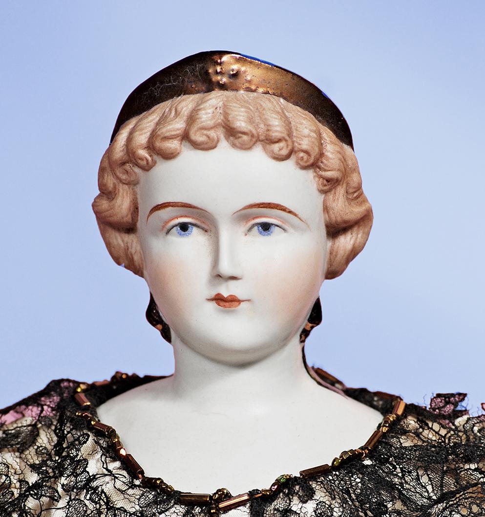 EXQUISITE BISQUE LADY WITH LUSTRE CORONET - BY ARTIST: EXQUISITE BISQUE LADY WITH LUSTRE CORONET - BY ARTIST RUTH BARTLOME. 18”. Marks: RmB. Bisque shoulderhead with sculpted brown hair in elaborate arrangement, decorated with luster finished tiara and 