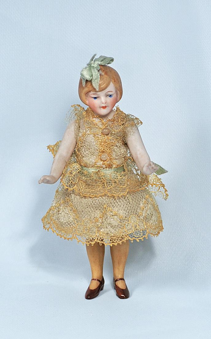 GERMAN ALL-BISQUE FLAPPER DOLL WITH YELLOW STOCKINGS (1 of 1)