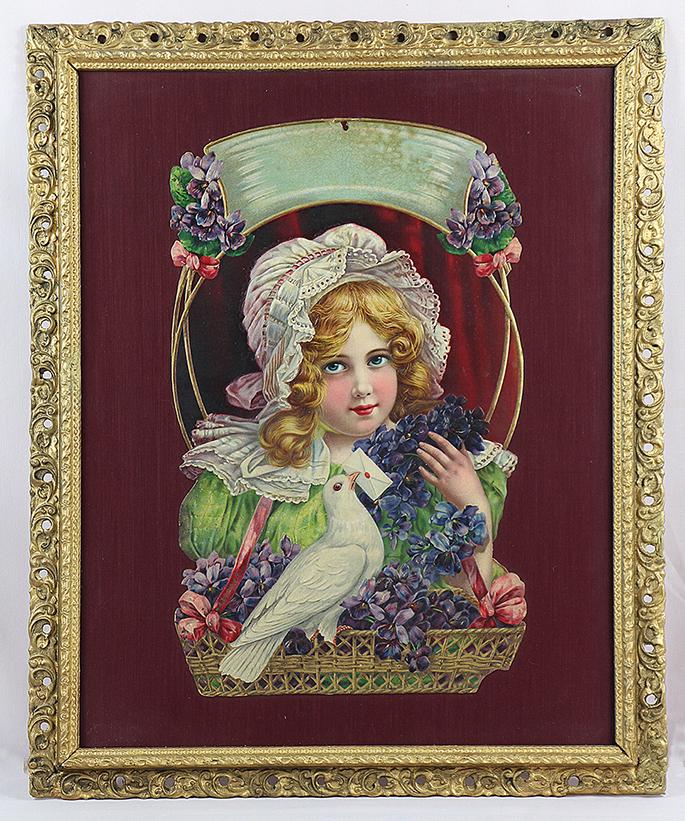 EARLY VICTORIAN ERA CHROMOLITH DIE CUT IN ORNATE FRAME: EARLY VICTORIAN ERA CHROMOLITH DIE CUT IN ORNATE FRAME. 23” x 19”. Depicting young girl with basket of violets and white dove delivering letter, very clear and colorful print matted in ornate gold
