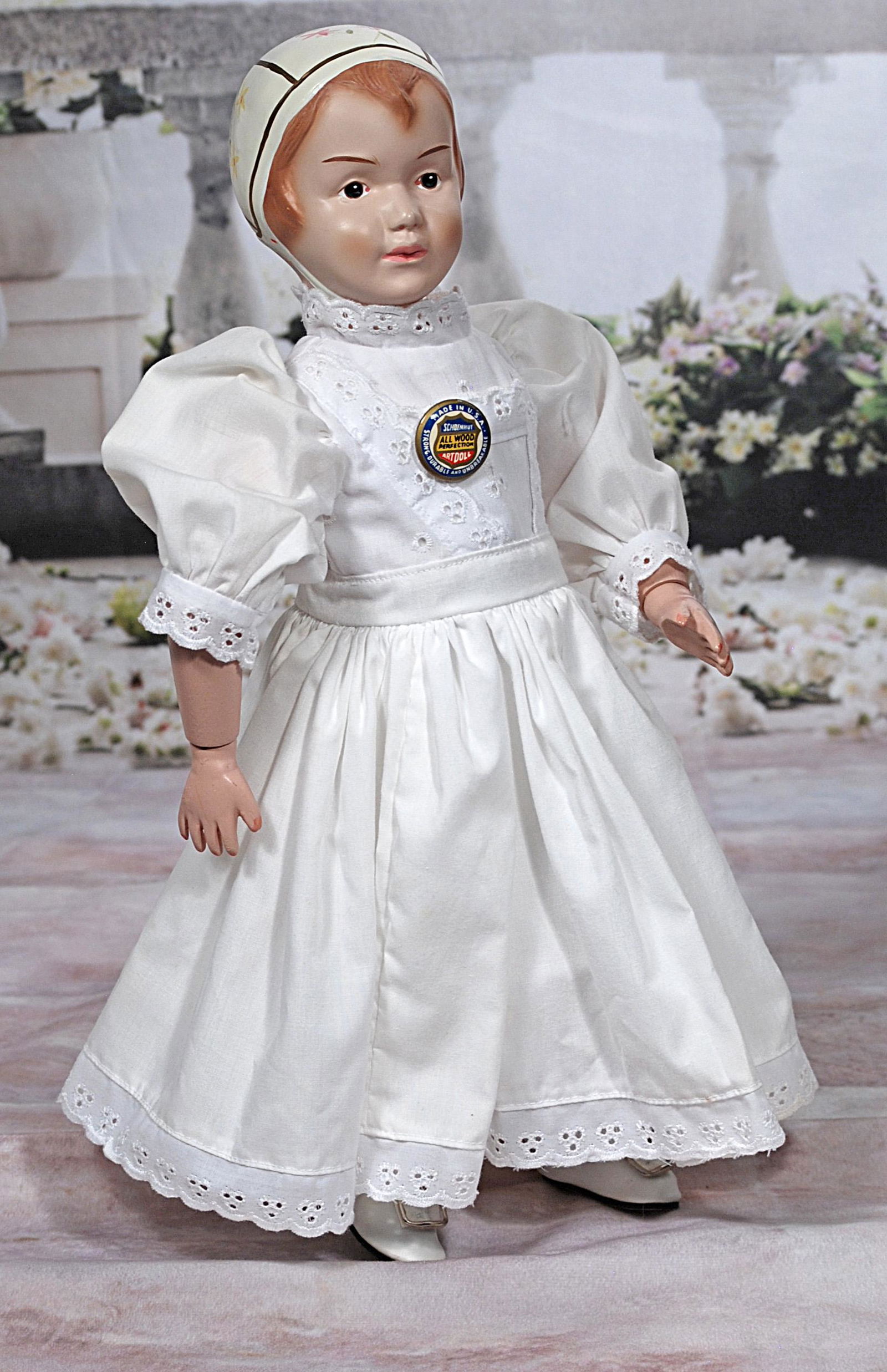 SCHOENHUT BONNET GIRL U: SCHOENHUT BONNET GIRL U. S. POST OFFICE COMMEMORATIVE DOLL. 16”. Reproduction of the 1915 American classic doll by Schoenhut; has painted features and sculpted bonnet with hand-painted deocorations,