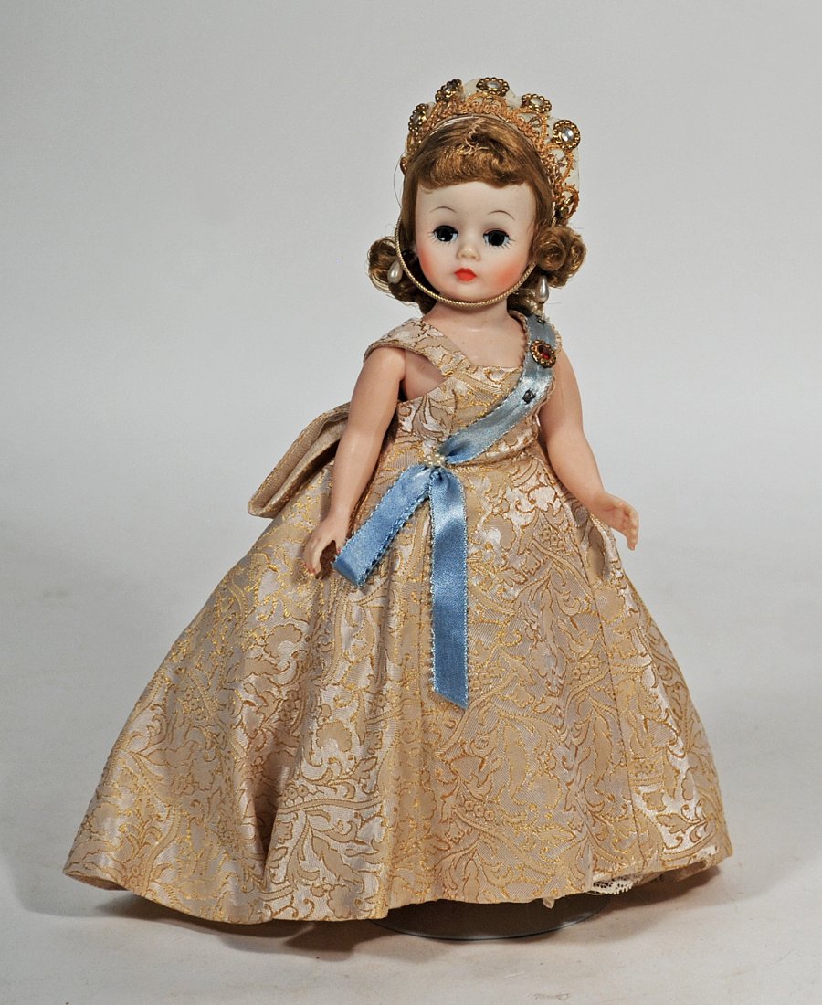 ALEXANDER CISSETTE QUEEN: ALEXANDER CISSETTE QUEEN. 10”. Hard plastic, blonde-haired Cissette in gold brocade gown with jeweled sash, taffeta petticoat, panty, hose, high heel shoes, ornate gold crown, pearl earrings. Commen