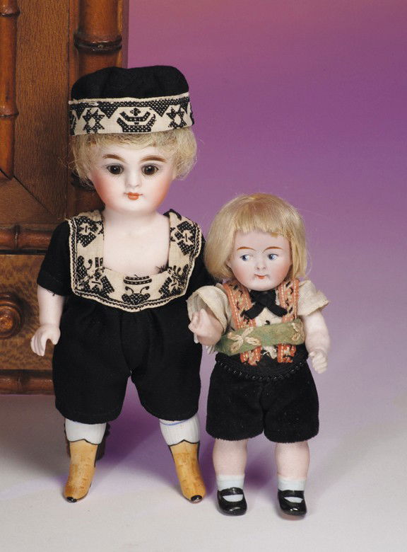 KESTNER ALL-BISQUE DOLL WITH YELLOW BOOTS. Marks: KESTNER ALL-BISQUE DOLL WITH YELLOW BOOTS. Marks: 184. 6". Jointed shoulders and hips, stationary brown glass eyes, painted lashes, feathered brows, closed mouth, painted white ribbed stockings, yello