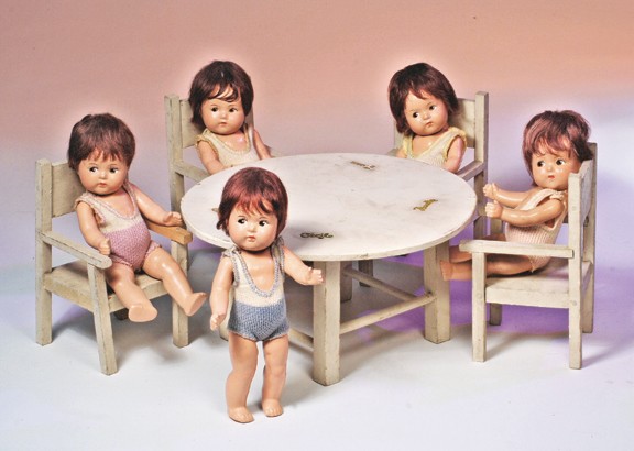 ALEXANDER COMPOSITION DIONNE QUINTS IN RARE SWIMSU: ALEXANDER COMPOSITION DIONNE QUINTS IN RARE SWIMSUITS WITH ALEXANDER TABLE & CHAIR SET. 8" dolls marked Alexander. Composition socket heads on five-piece jointed toddler bodies, painted features, brow