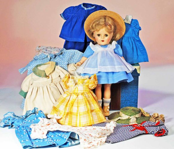 ALEXANDER "MC GUFFEY ANNA" COMPOSITION DOLL WITH W: ALEXANDER "MC GUFFEY ANNA" COMPOSITION DOLL WITH WARDROBE. Marks: 15. 14". Composition socket head, five-piece jointed composition body, green sleep eyes, real upper lashes, painted lower lashes, gray
