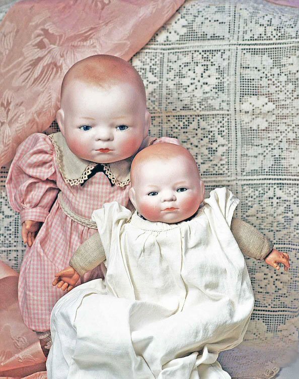 TWO GERMAN BISQUE BYE-LO BABIES. Marks: Copr. Gr: TWO GERMAN BISQUE BYE-LO BABIES. Marks: Copr. Grace S. Putnam. 9" & 10 ½". Each has bisque swivel head with molded and painted brown hair, blue sleep eyes, painted lashes, tinted brows, closed mouth,