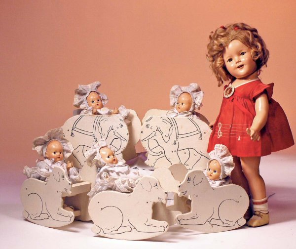 SET OF COMPOSITION DIONNE QUINT BABIES BY "SUPERIO: SET OF COMPOSITION DIONNE QUINT BABIES BY "SUPERIOR MOLD" WITH ORIGINAL ANIMAL ROCKERS. Marks: None. 8". Socket head dolls on five-piece baby bodies, painted hair and features, original diapers, pale 